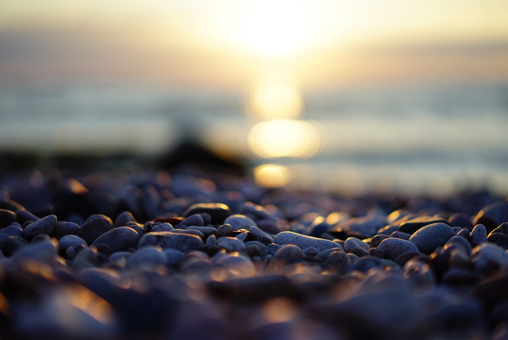 A sunset as seen from the stones of a beach in Visby, Gotland